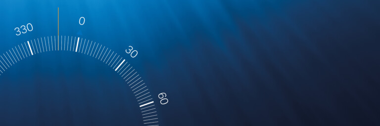 Compass display with numbers from 330 to 60 degrees on a dark blue background with sun rays.