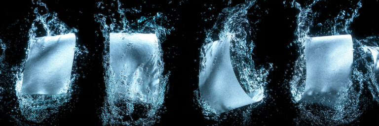 4 documents surrounded by dynamic water and a dark background.