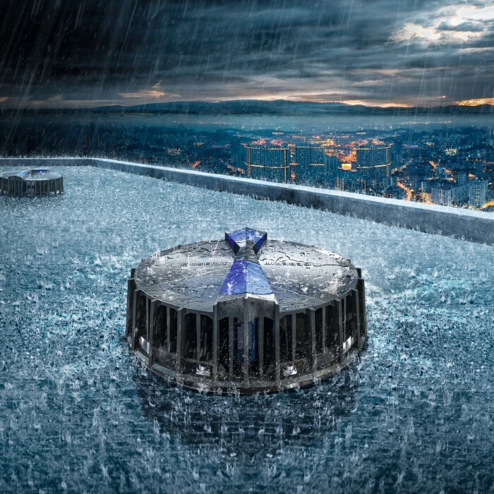 A roof drainage system surrounded by heavy rain, with dark clouds and a skyline in the background.