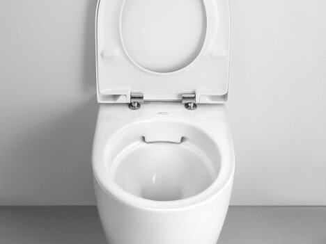 A white rimless WC ceramic mounted on the wall.