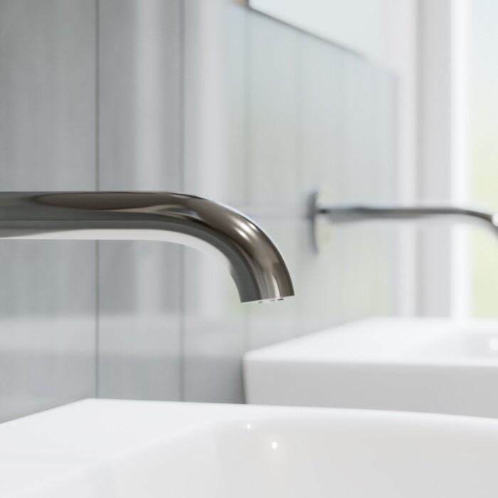 Modern bathroom scene featuring two sleek silver faucets mounted on the wall over white sinks against a light grey backdrop.