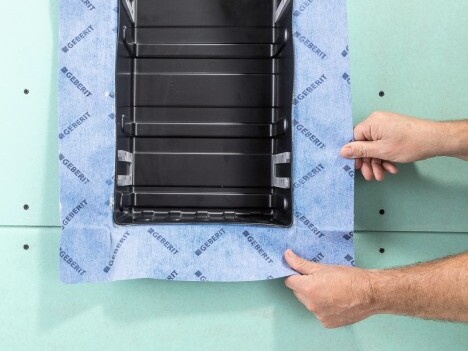 Close up of a storage box and two hands being featured.