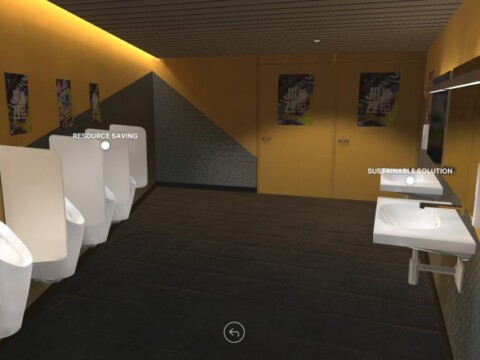 Ein modernes Badezimmer mit gelben Wänden, mehreren Urinalen, zwei Waschbecken und Plakaten an der Wand.