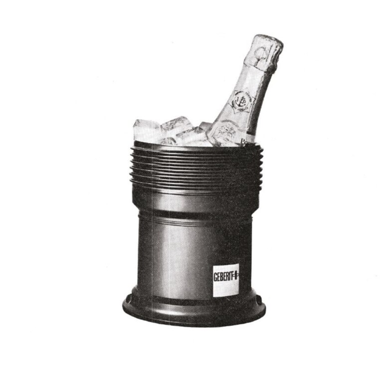 A black pipe with a champagne and ice in it.