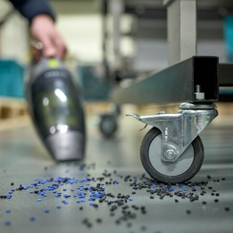 Close-up of granules and a wheel.