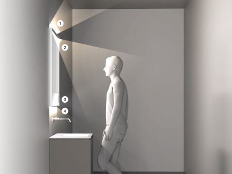 Ein minimalistischer Raum mit einer Person, die vor einem Spiegel steht und Licht auf sie projiziert, neben einem Waschbecken.