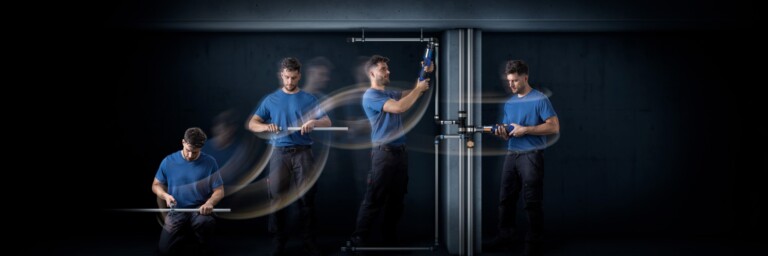 Ein Handwerker in blauer Kleidung führt verschiedene Arbeiten an Rohren aus, wobei Bewegungsunschärfe den Eindruck von Dynamik vermittelt.