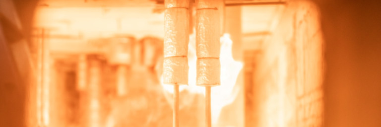 A look inside the furnace, with two FlowFit pipes at the front