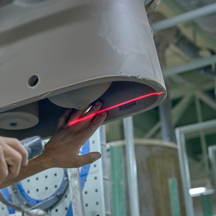 An employee scans the barcode.