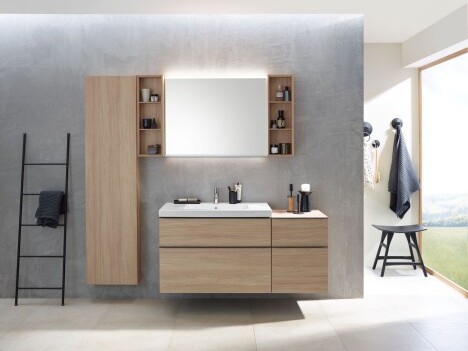 Modern bathroom interior featuring a wooden vanity with a sink, mirror, storage shelves, and a ladder for towels.