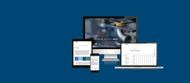 Four different devices displaying a digital annual report, including a desktop, tablet, and mobile phone, all against a blue background.